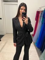 Completo giacca cintura pantalone a zampa